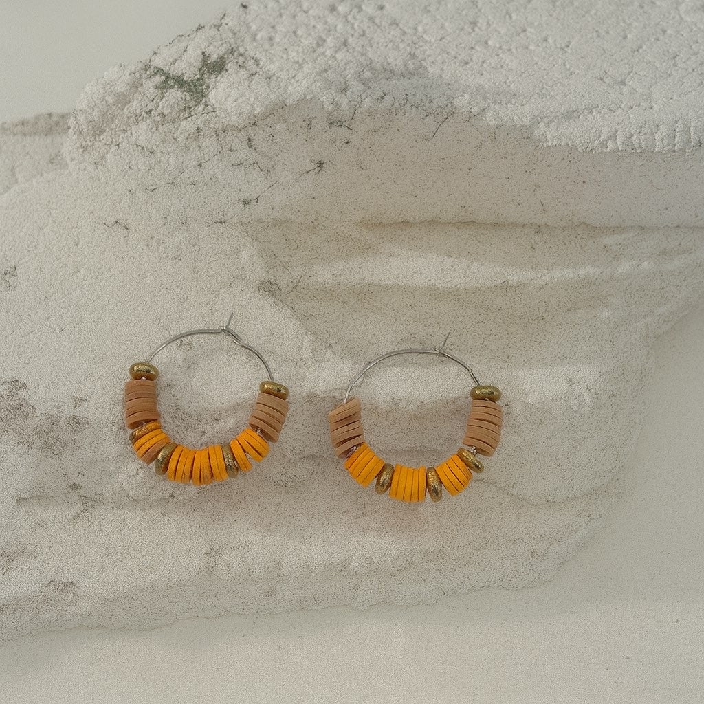 Boucle d’oreille perle plate orange
