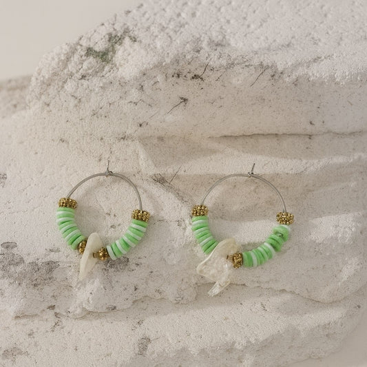 Boucle d’oreille perle plate feuille