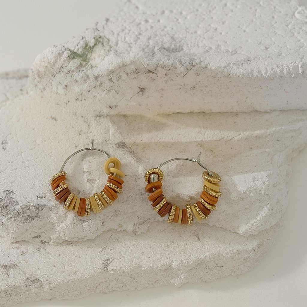 Boucle d’oreille perle plate doré